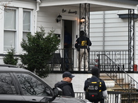 ATF agents are on the scene conducting a court-authorized action and entering a house in Newark, New Jersey, United States, on March 6, 2024...