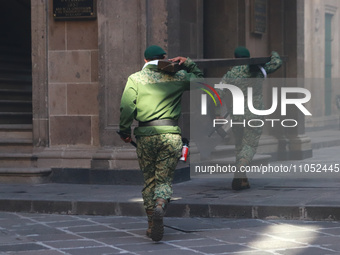 Military police are guarding the main door of the National Palace in Mexico City, Mexico, on March 6, 2024, as demonstrators gather over the...
