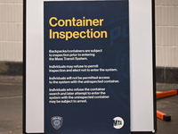 A sign at a police checkpoint is warning that a container inspection is currently underway at 34th Street-Penn Station during rush hour on T...