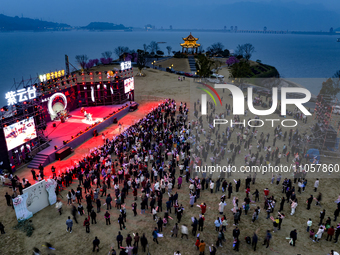 A large number of tourists are attending the ''Orange Music Festival'' at Tianwen Park on Muyu Island of Zigui County, in Yichang, China, on...