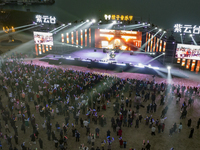 A large number of tourists are attending the ''Orange Music Festival'' at Tianwen Park on Muyu Island of Zigui County, in Yichang, China, on...