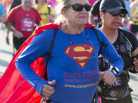 Barcelona, Catalonia, Spain. A runner dressed as Superman during the Marathon of Barcelona. More of 20.000 runners participate in the 38th o...