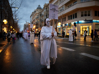 A woman is wearing a mask that symbolizes a murdered woman before the International Women's Day demonstration in Granada, Spain, on March 8,...