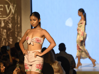 A model is presenting a creation by Sri Lankan fashion designer Chirani during Colombo Fashion Week in Colombo, Sri Lanka, on March 8, 2024....