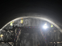 Workers are preparing for blasting at the exit of the Tiemengguan tunnel in Bazhou, Xinjiang province, China, on March 9, 2024. (