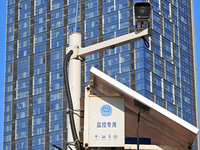 Public security authorities are setting up surveillance equipment on a street in Yantai, East China's Shandong province, on March 9, 2024. O...