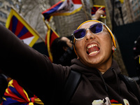  A demonstrator poses during a march through the streets in support of the Tibetan National Uprising Day on March 10,2023 in New York City U...