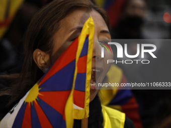 A demonstrator marches through the streets in support of the Tibetan National Uprising Day on March 10,2023 in New York City USA. The march...