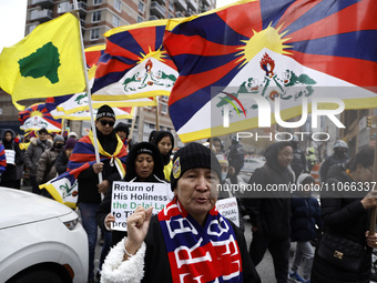 Demonstrators march through the streets in support of the Tibetan National Uprising Day on March 10,2023 in New York City USA. The march I h...