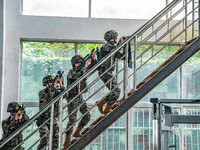 Armed police officers and soldiers are organizing an actual combat drill in Nanning, Guangxi Province, China, on March 12, 2024. (