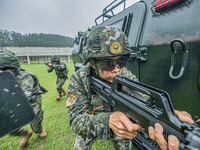 Armed police officers and soldiers are organizing an actual combat drill in Nanning, Guangxi Province, China, on March 12, 2024. (