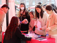 Female college students are looking for jobs at the 2024 Women's Campus job fair in Huaibei, Anhui province, China, on March 12, 2024. (