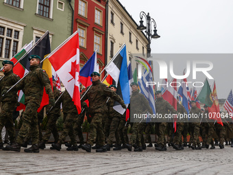 Soldiers of the Polish army are seen ath the Main Square while taking part in official celebration of the 25th anniversary of Poland's acces...
