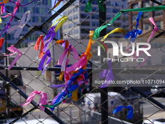 Colorful streamers are adorning a fence at the Rail Park trail on the reclaimed Reading Viaduct in Center City, Philadelphia, PA, USA, on Ma...