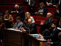 Justice Minister Eric Dupond-Moretti is sitting on the government benches during the session of questions to the government in Paris, France...