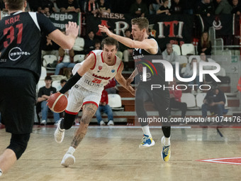 Hugo Besson of Itelyum Varese and Jakub Tuma of Nymburk are playing basketball during the FIBA Europe Cup match between Openjobmetis Varese...