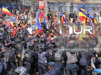 Nepal Police are baton-charging pro-monarchy supporters as they try to disrupt traffic during a protest march in Kathmandu, Nepal, on March...