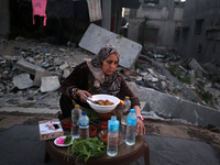 A Palestinian family is gathering for the ''iftar'' meal, the breaking of the fast, on the fourth day of the Muslim holy fasting month of Ra...
