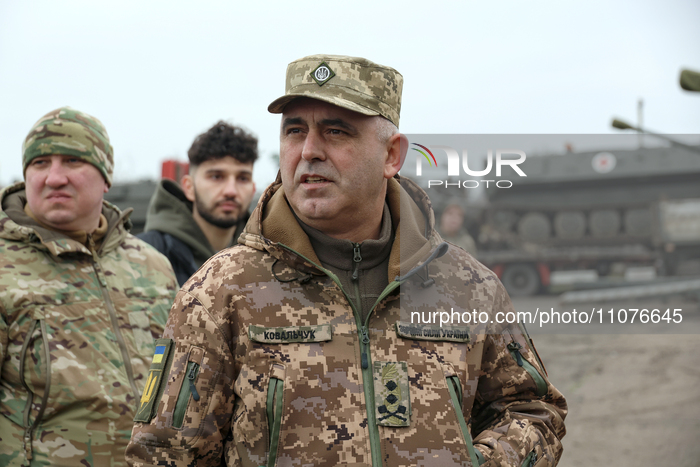 Major General Andrii Kovalchuk (R), Commander of the Operational Command South of the Land Forces of the Armed Forces of Ukraine, is attendi...