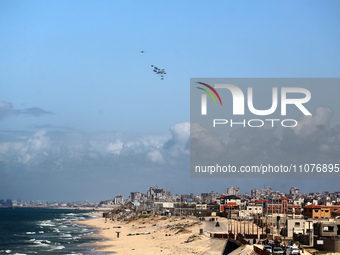 Parachutes are currently attached to parcels of humanitarian aid being airdropped over Gaza City, Palestine, on March 15, 2024, as the confl...