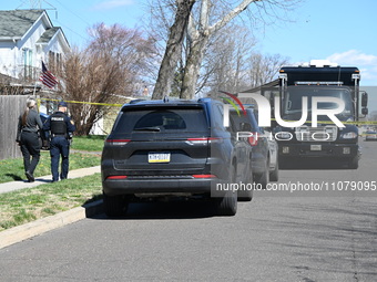 Investigators are working at a home on Edgewood Lane in Falls Township, Pennsylvania, in the area of Levittown, where several people are dea...