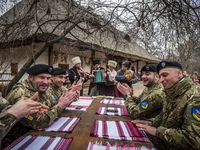 Soldiers of Georgia National Legion (part of Armed Forces of Ukraine) on the Maslenitsa festivities in Mamayeva Sloboda, Kyiv, Ukraine on Ma...