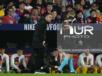 Xavi Hernandez head coach of Barcelona protest to referee during the LaLiga EA Sports match between Atletico Madrid and FC Barcelona at Civi...