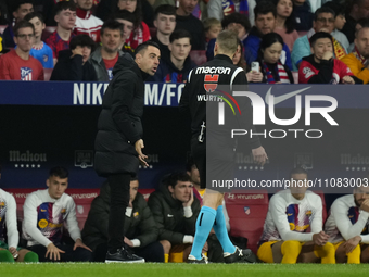 Xavi Hernandez head coach of Barcelona protest to referee during the LaLiga EA Sports match between Atletico Madrid and FC Barcelona at Civi...