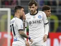 Matteo Politano of Napoli is talking with Khvicha Kvaratskhelia of Napoli during the Serie A soccer match between Inter FC and SSC Napoli at...