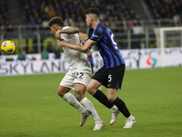 Giovanni Di Lorenzo of Napoli is being challenged by Alessandro Bastoni of Inter during the Serie A soccer match between Inter FC and SSC Na...