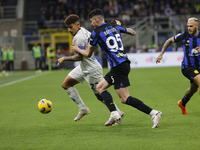 Giovanni Di Lorenzo of Napoli is being challenged by Alessandro Bastoni of Inter during the Serie A soccer match between Inter FC and SSC Na...