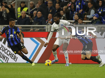 Frank Zambo Anguissa of Napoli is in action during the Serie A soccer match between Inter FC and SSC Napoli at Stadio Meazza in Milan, Italy...