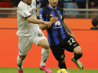 Stanislav Lobotka of Napoli is being challenged by Henrikh Mkhitaryan of Inter during the Serie A soccer match between Inter FC and SSC Napo...