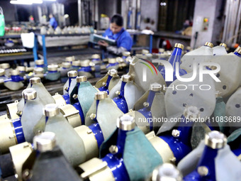 A worker is producing foreign trade products on a workshop production line at a spandex company in the Lianyungang Economic and Technologica...