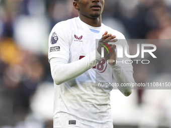 Moussa Diaby of Aston Villa is thanking the traveling supporters at full time during the Premier League match between West Ham United and As...