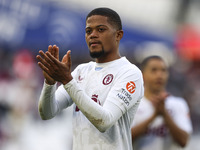 Leon Bailey is thanking the traveling supporters at full time during the Premier League match between West Ham United and Aston Villa at the...