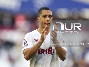 Youri Tielemans of Aston Villa is thanking the traveling supporters at full time during the Premier League match between West Ham United and...