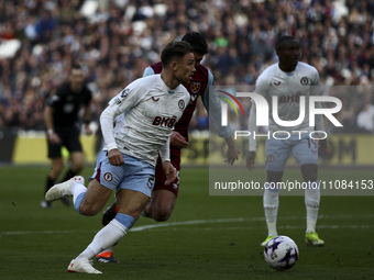 Matty Cash of Aston Villa is on the ball during the Premier League match between West Ham United and Aston Villa at the London Stadium, Stra...