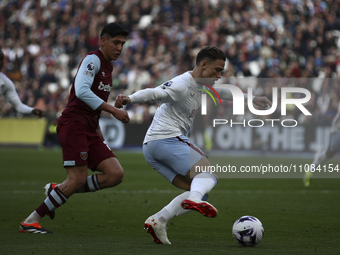 Matty Cash of Aston Villa is on the ball during the Premier League match between West Ham United and Aston Villa at the London Stadium in St...