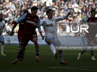 Edson Alvarez of West Ham United is competing with Nicolo Zaniolo of Aston Villa for the ball during the Premier League match between West H...