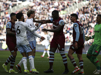 Nicolo Zaniolo of Aston Villa is clashing with Kurt Zouma of West Ham United during the Premier League match between West Ham United and Ast...