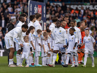 Wilfried Gnonto of Leeds United is posing with his mascot before the Sky Bet Championship match against Millwall at Elland Road in Leeds, on...