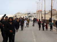 Displaced Palestinians are fleeing from the area near Gaza City's al-Shifa hospital and are walking along the coastal highway as they arrive...