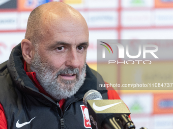 Coach Michal Probierz is speaking at the team Poland press conference before the Euro 2024 play-off match against Estonia in Warsaw, Poland,...