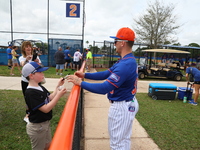 New York Mets minor leaguer Jett Williams #90 is signing for a fan during spring training workouts at the Mets Minor League Complex in Port...