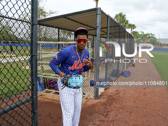 Yohairo Cuevas #20 of the New York Mets minor league is flashing some peace signs during spring training workouts at the Mets Minor League C...