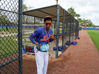 Yohairo Cuevas #20 of the New York Mets minor league is flashing some peace signs during spring training workouts at the Mets Minor League C...