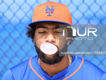 New York Mets minor league pitcher Joseph Yabbour #61 is blowing a bubble during spring training workouts at the Mets Minor League Complex i...