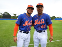 Ronald Hernandez #99 and Andriel Lantigua #44, minor league catchers for the New York Mets, are posing for a photo during spring training wo...