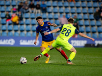 Iker Benito of FC Andorra and Felix Garreta of SD Amorebieta are competing for the ball during the LaLiga Hypermotion 2023 - 2024 match betw...